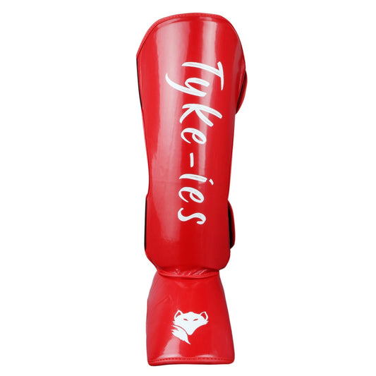Technical view of red Tyke-ies Protect shin guard highlighting the impact-shield foam.
