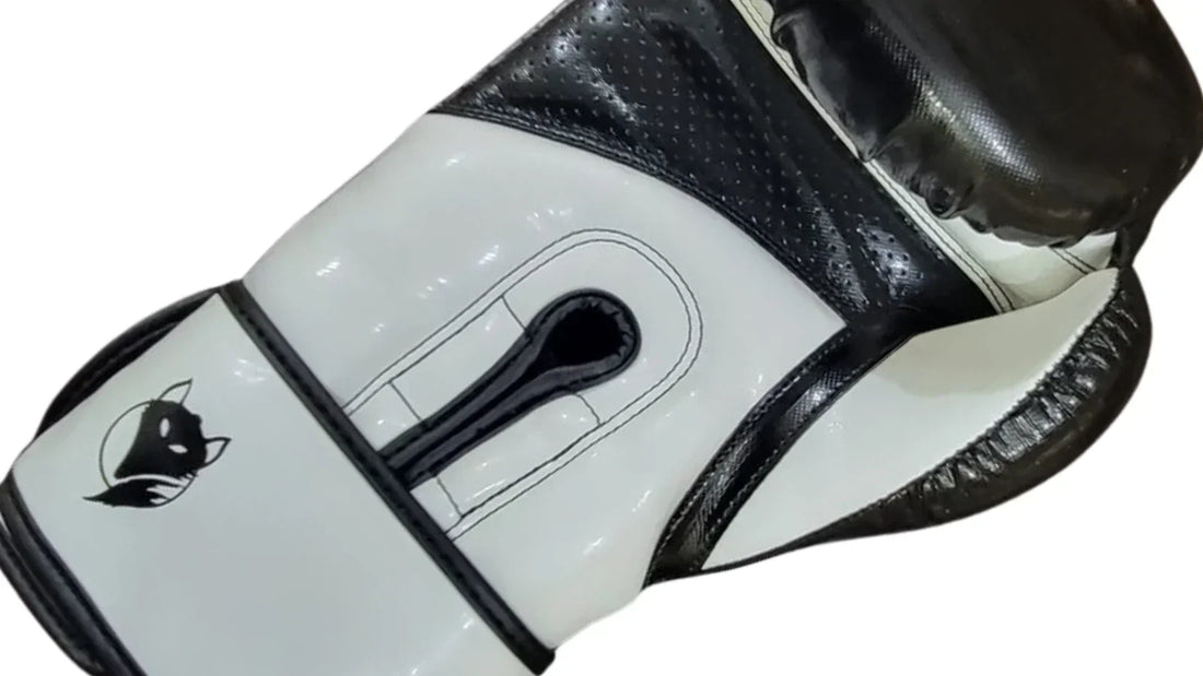Tyke-ies black and white boxing glove with the iconic fox logo on a white background. 