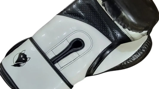 Tyke-ies black and white boxing glove with the iconic fox logo on a white background. 