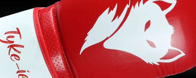 Tyke-ies Sleek Series boxing gloves featuring the Pin Dot PU model with injected latex-moulded padding for superior shock absorption.