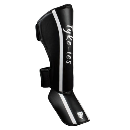 Side view of black Tyke-ies Defend shin guards showing the dual non-slip straps.