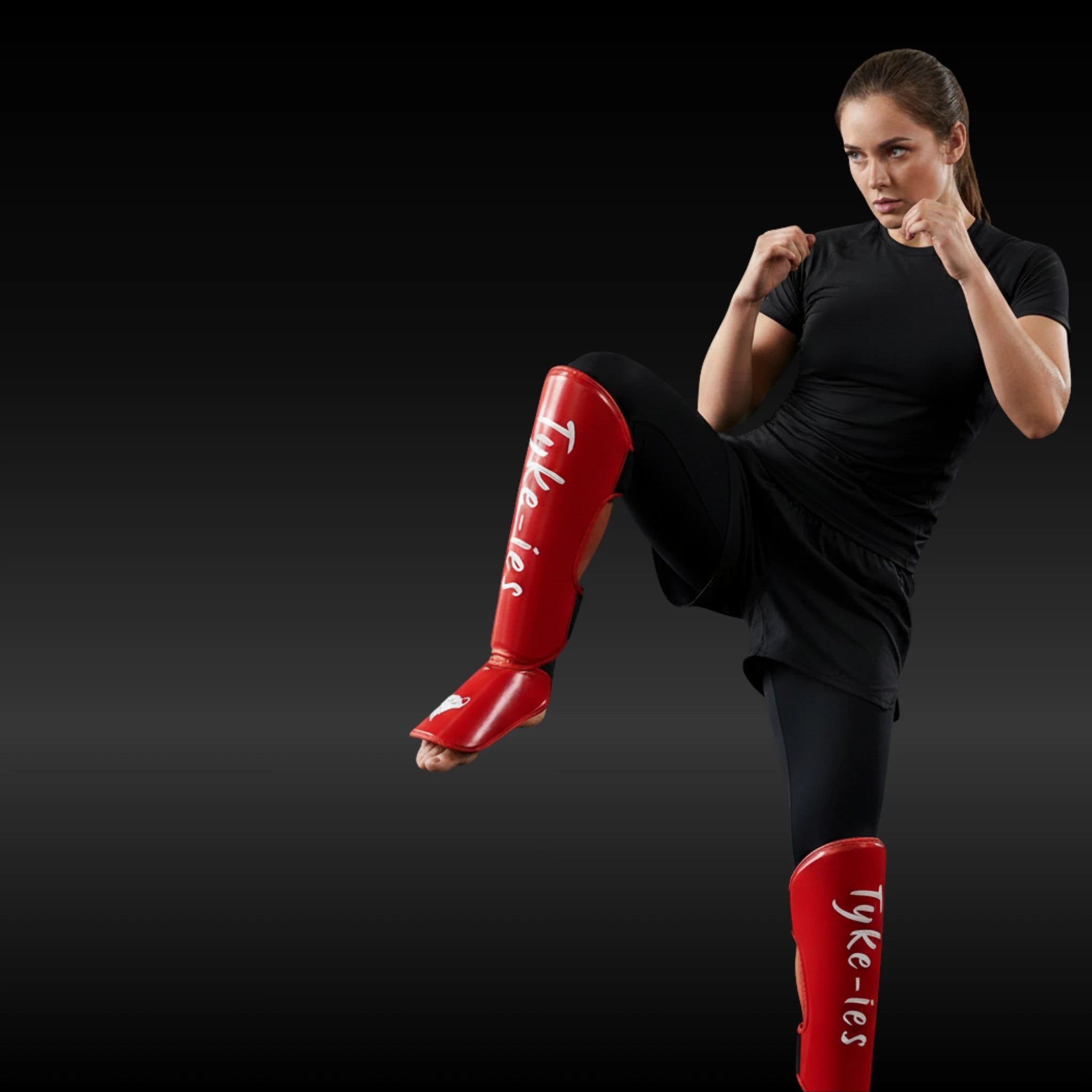 Athlete wearing Tyke-ies high-density foam shinguards for leg protection and kicking drills.