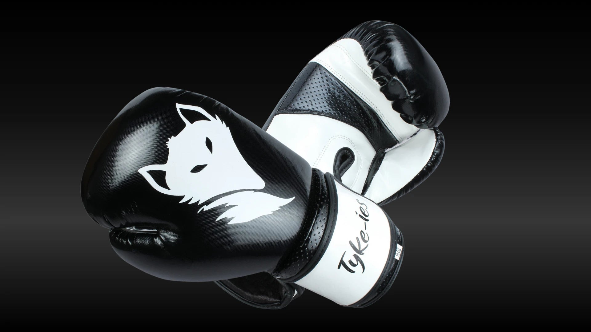 Load video: Embedded video showcasing the Tyke-ies Sleek Model boxing gloves. The video highlights the unique texture of the PIN DOT Flex PU material and the ergonomic, high-performance fit for professional fighters.